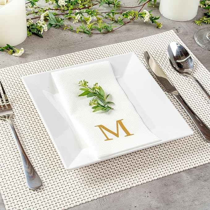 Restaurantware Napkins Pack of 300 Gold Letter M Linen-Feel Paper Disposable Guest Towels 15.75 x 7.87 Inches, Elegant Airlaid White Napkins For Birthdays, Weddings and Catering Events